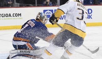 Nashville Predators left wing Viktor Arvidsson (33) scores a goal past New York Islanders goaltender Thomas Greiss (1) during the first period of an NHL hockey game, Saturday, Oct. 6, 2018, in New York. (AP Photo/Mary Altaffer)