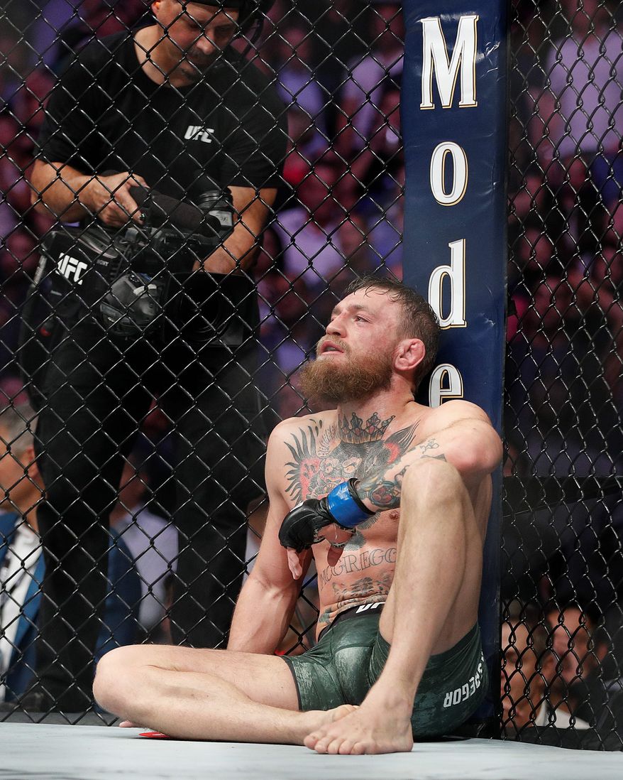 Conor McGregor reacts after losing by submission to Khabib Nurmagomedov in a lightweight title mixed martial arts bout at UFC 229 in Las Vegas on Saturday. (ASSOCIATED PRESS)