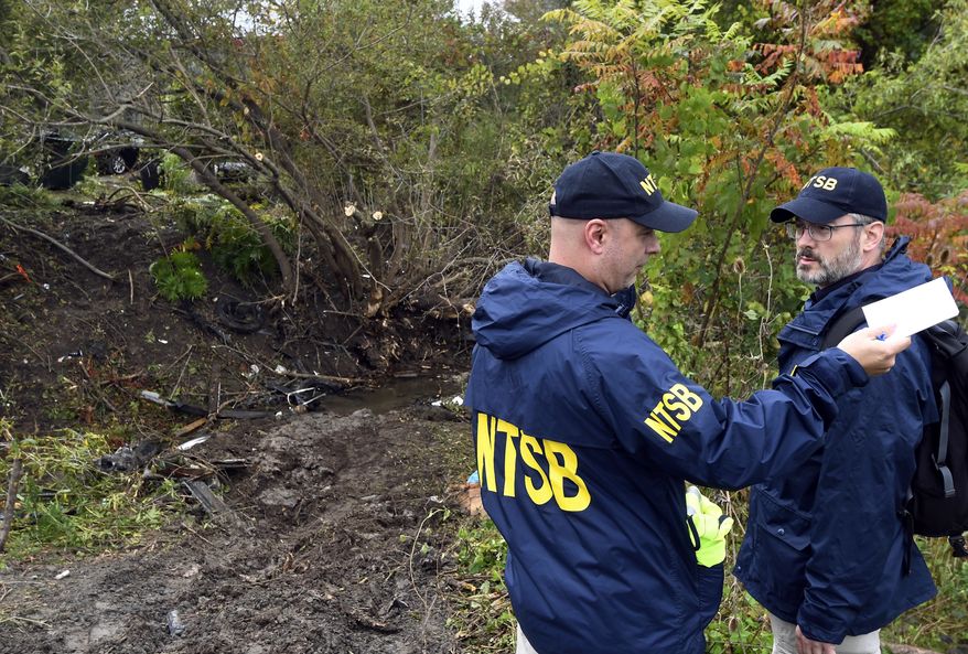 Members of the National Transportation Safety Board work at the scene of a fatal crash, in Schoharie, N.Y., Sunday, Oct. 7, 2018. (AP Photo/Hans Pennink) ** FILE **