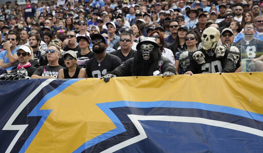 Oakland Raiders fans look on during the first half of an NFL football game against the Los Angeles Chargers Sunday, Oct. 7, 2018, in Carson, Calif. (AP Photo/Jae C. Hong)