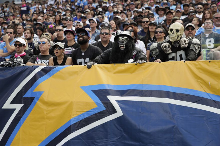 Oakland Raiders fans look on during the first half of an NFL football game against the Los Angeles Chargers Sunday, Oct. 7, 2018, in Carson, Calif. (AP Photo/Jae C. Hong)