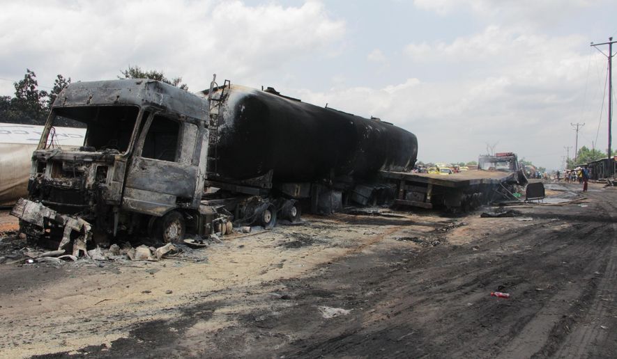 The aftermath of a burned tanker truck in Mbuba, Democratic Republic of Congo, Saturday, Oct. 6, 2018. At least 50 people were killed and more than 100 were badly burned when a tanker truck in Congo collided with another truck and, as villagers rushed to collect the leaking fuel, burst into flames, witnesses and officials said Saturday. (Henri Alimasi/Congo’s health ministry via AP)