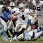 Oakland Raiders quarterback Derek Carr (4) scrambles during the second half of an NFL football game against the Los Angeles Chargers, Sunday, Oct. 7, 2018, in Carson, Calif. (AP Photo/Jae C. Hong)