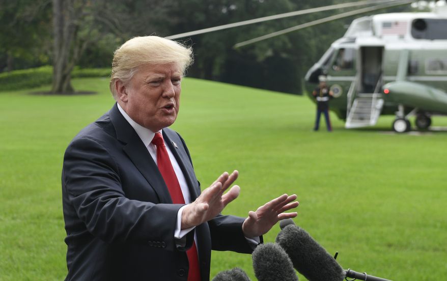 President Donald Trump speaks to reporters on the South Lawn of the White House in Washington, Monday, Oct. 8, 2018, as he heads to Marine One for the short trip to Andrews Air Force Base. Trump is traveling to Florida for the day. (AP Photo/Susan Walsh)