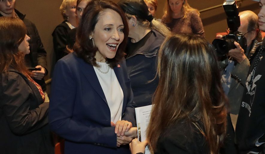 Sen. Maria Cantwell, D-Wash., left, talks with an audience member following a debate with Cantwell's Republican challenger, Susan Hutchison, Monday, Oct. 8, 2018, at Pacific Lutheran University in Tacoma, Wash. (AP Photo/Ted S. Warren)