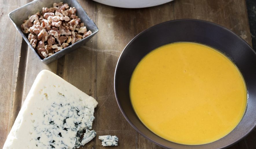 This undated photo provided by America's Test Kitchen in September 2018 shows 11th-hour harvest pumpkin soup in Brookline, Mass. This recipe appears in the cookbook “All-Time Best Soups.” (Daniel J. van Ackere/America's Test Kitchen via AP)
