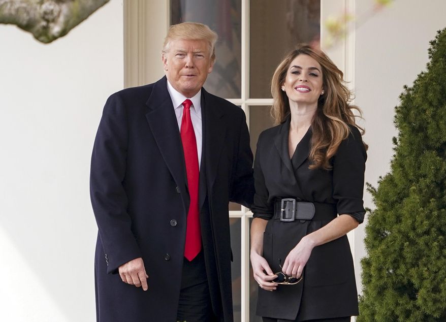 FILE - In this March 29, 2018, file photo, President Donald Trump poses for members of the media with then White House Communications Director Hope Hicks on her last day before he boards Marine One on the South Lawn of the White House in Washington. Hicks is taking on a similar role at the new Fox company, meaning she'll supervise messaging at her former boss' favorite television network. (AP Photo/Andrew Harnik, File)