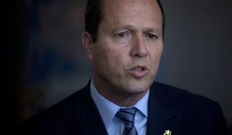 File - In this Tuesday, April 25, 2017 file photo, Jerusalem Mayor, Nir Barkat speaks during an interview with the Associated Press at his office in Jerusalem. Brake is calling on the international community to consider his proposal to end the local operations of the U.N. agency for Palestinian refugees, saying there is &amp;quot;no such thing&amp;quot; as a refugee in the city. (AP Photo/Sebastian Scheiner, File)