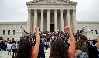 Activists protest on the steps and plaza of the Supreme Court after the confirmation vote of Supreme Court nominee Brett Kavanaugh, on Capitol Hill, Saturday, Oct. 6, 2018 in Washington. (AP Photo/Alex Brandon) ** FILE **