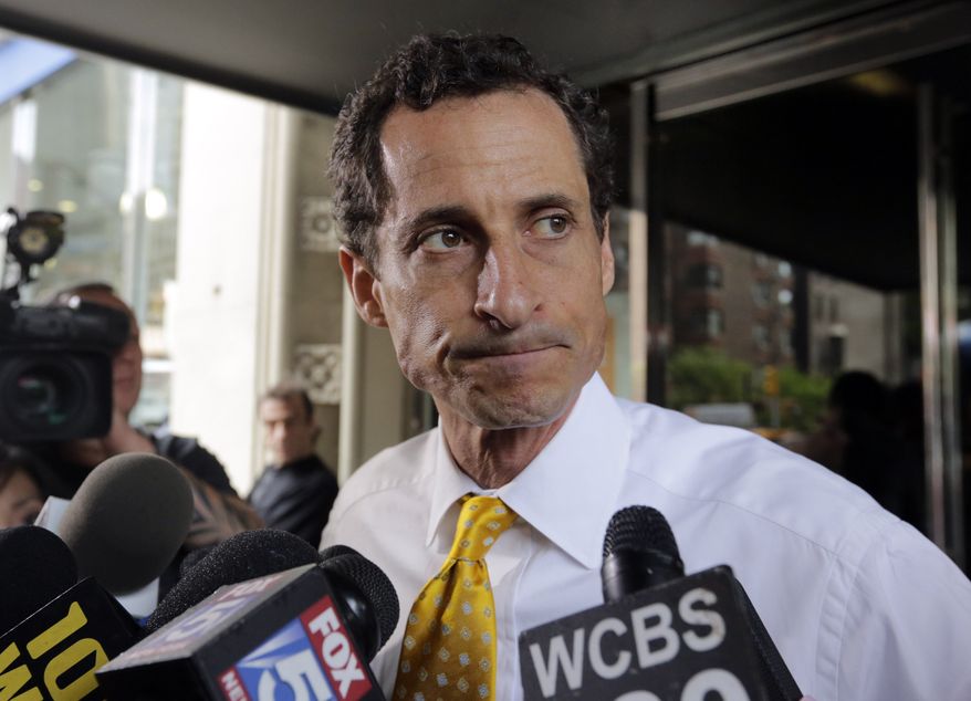 In this July 24, 2013, file photo, former New York Rep. Anthony Weiner leaves his apartment building in New York. (AP Photo/Richard Drew, File)