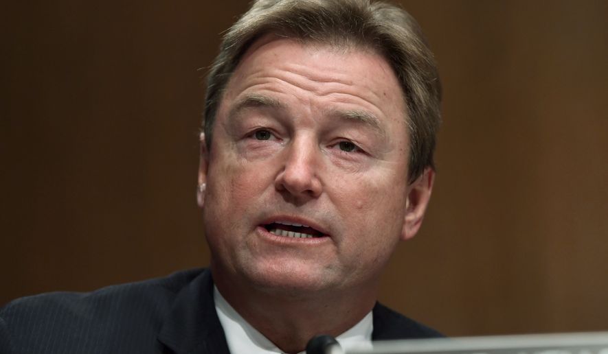 In this Jan. 30, 2018, file photo, Sen. Dean Heller, R-Nev., asks a question of Treasury Secretary Steven Mnuchin during a Senate Banking Committee hearing on Capitol Hill in Washington. (AP Photo/Susan Walsh, file)