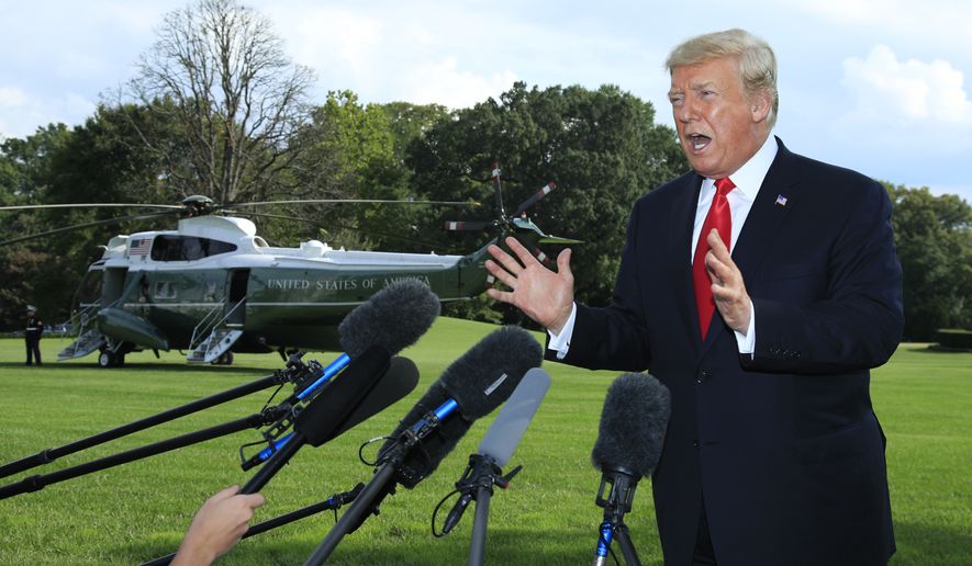President Donald Trump speaks to reporters on the South Lawn before leaving the White House in Washington, Tuesday, Oct. 9, 2018. (AP Photo/Manuel Balce Ceneta)