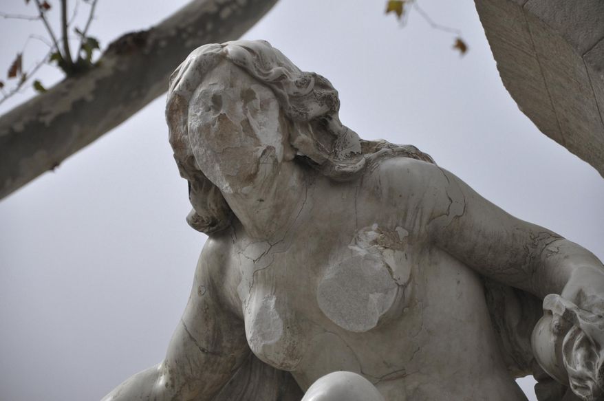 This picture taken on Dec. 18, 2017, shows the statue of the Ain El Fouara fountain located in the heart of Setif, nearly 300 kilometers (185 miles) east of Algiers, the Algerian capital, after being vandalized in 2017. The colonial-era statue is the work of French sculptor Francis Saint Vidal, dating to 1889. A man with a hammer has attacked and damaged a statue of a bare-breasted woman, an emblem of the eastern city of Setif, in the latest in a series of such attacks. (AP Photo)