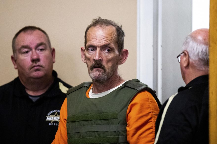 Kirby Gene Wallace enters the courtroom during his first appearance at the Stewart County Courthouse Tuesday, Oct. 9, 2018, in Dover, Tenn. Wallace, a multiple-murder suspect who led Tennessee law enforcement on an intense 7-day manhunt was captured without a struggle Friday morning, Oct. 5, in a wooded area about two hours northwest of Nashville. Wallace is wanted in two counties on charges that include murder, arson and kidnapping. (Courtney Pedroza/The Tennessean via AP, Pool)