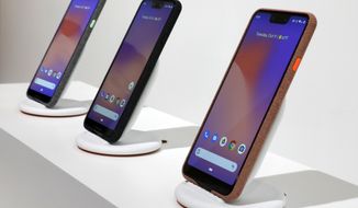 New Google Pixel 3 smartphones are displayed in New York, Tuesday, Oct. 9, 2018. Google introduced two new smartphones in its relentless push to increase the usage of its digital services and promote its Android software that already powers most of the mobile devices in the world.(AP Photo/Richard Drew)