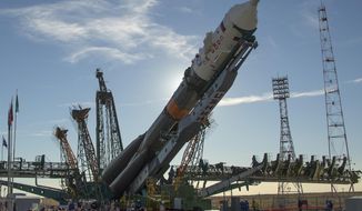 The Soyuz rocket is raised into a vertical position on the launch pad, Tuesday, Oct. 9, 2018 at the Baikonur Cosmodrome in Kazakhstan. The new Soyuz mission to the International Space Station (ISS) is scheduled on Thursday, Oct. 11, with U.S. astronaut Nick Hague and Russian cosmonaut Alexey Ovchinin. (Bill Ingalls/NASA via AP)