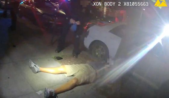 FILE - This June 29, 2018, file video image from a police officer&#39;s body cam and provided by Portland State University shows Jason Washington after he was shot and killed by Portland State University police officers in Portland, Ore. Grand jury testimony released by a district attorney Tuesday, Oct. 9, into the fatal shooting by university police of a black man during a brawl outside a Portland, Oregon, bar describes a chaotic scene in which the two officers had to make a split-second decision when they saw a pistol in the man&#39;s hand. (Portland State University via AP, File)