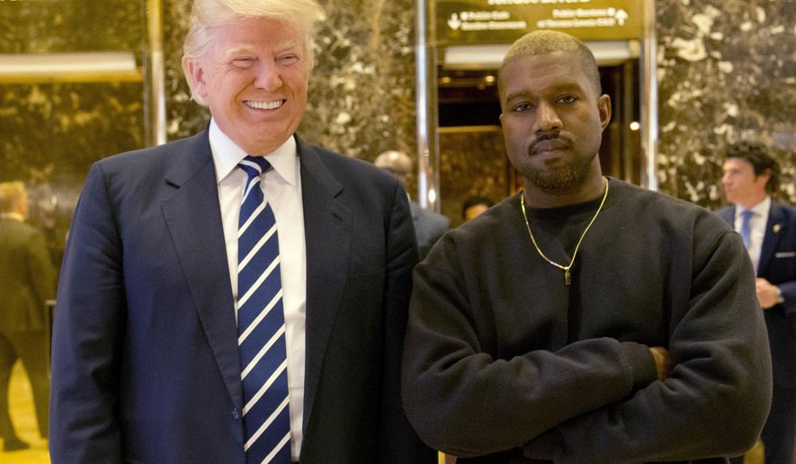 FILE - In this Dec. 13, 2016, file photo, President-elect Donald Trump and Kanye West pose for a picture in the lobby of Trump Tower in New York.  Kanye West will visit the White House on Thursday to meet with President Donald Trump and his son-in-law Jared Kushner talk about manufacturing in America, gang violence, prison reform and Chicago violence. (AP Photo/Seth Wenig, File)