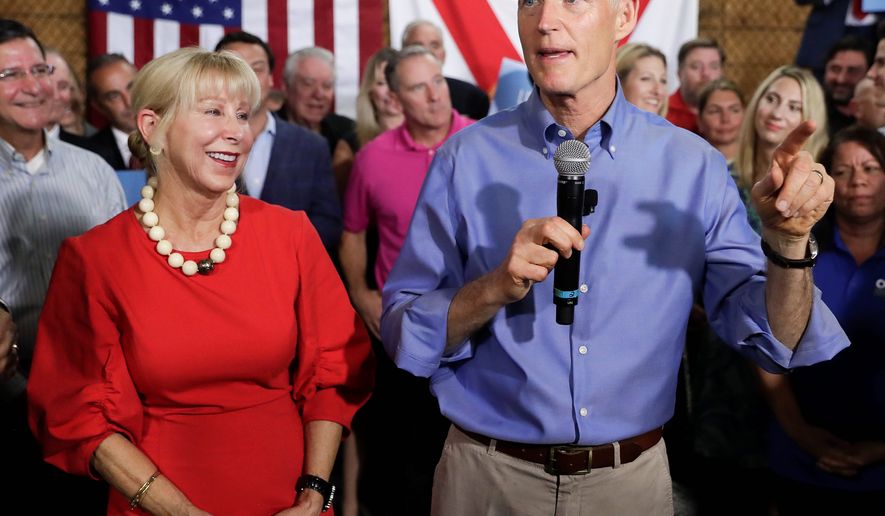 &quot;My wife runs her own finances — that may be a hard thing for Sen. [Bill] Nelson to understand,&quot; said Gov. Rick Scott in a statement. His finances have been scrutinized, particularly regarding his blind trust and wife Ann Scott&#x27;s mirrored investments.
FILE — In this Monday, April 9, 2018, file photo, Florida Gov. Rick Scott, with his wife, Ann, announces his bid to run for the U.S. Senate at a news conference, in Orlando, Fla. Multimillionaire Scott maintains that he does not have any say over his fortune, but questions are mounting over his finances. (AP Photo/John Raoux, File) (Associated Press)