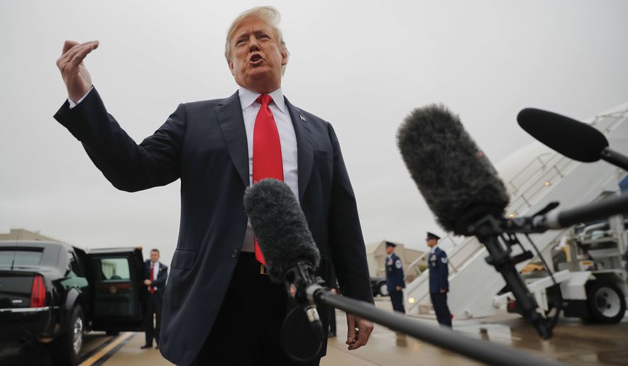 President Donald Trump talks on the tarmac to members of the media during his arrival at Topeka Regional Airport, Saturday, Oct. 6, 2018 in Topeka, Kan. Trump commented on the Senate confirmation of Supreme Court nominee Brett Kavanaugh. (AP Photo/Pablo Martinez Monsivais)