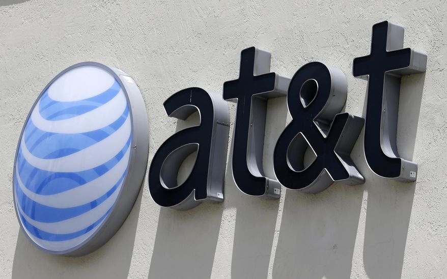 FILE - This July 27, 2017, file photo shows an AT&T logo at a store in Hialeah, Fla. AT&T and WarnerMedia are joining the ever-expanding list of companies offering a streaming video service. They say the service due to launch in late 2019 will include films, TV shows, documentaries, animation and other offerings. No pricing was announced. (AP Photo/Alan Diaz, File)