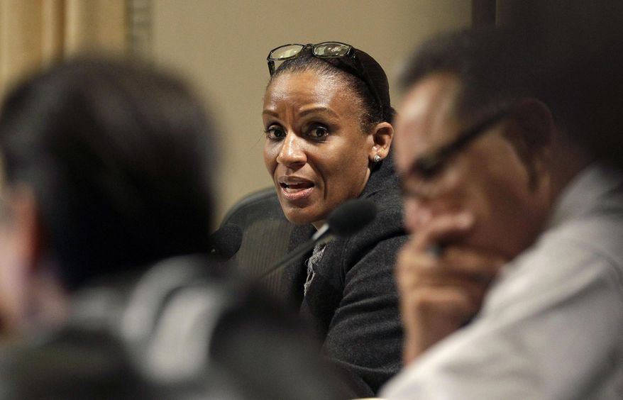 FILE - In this Feb. 2, 2011 file photo, Oakland City council member Desley Brooks, center, speaks at a City Council meeting at City Hall in Oakland, Calif. Brooks has filed a claim against the city or Oakland alleging the City Attorney's Office botched its case representing her from a lawsuit filed by a former Black Panther leader. (AP Photo/Jeff Chiu, File)