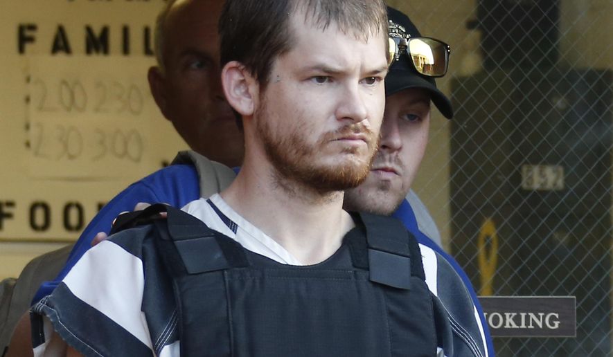 FILE - In this Sept. 11, 2014 file photo, Timothy Ray Jones Jr., is escorted by lawmen out of the Smith County Jail in Raleigh, Miss. A judge has delayed the death penalty trial of Jones Jr., charged with killing his five children until next year. The order from Circuit Judge Eugene Griffith Jr. says both sides agreed to delay Jones’ trial, scheduled to start Monday, Oct. 15, 2018. The order signed Tuesday says a new date will be picked once court dates for 2019 are set. (AP Photo/Rogelio V. Solis, File)