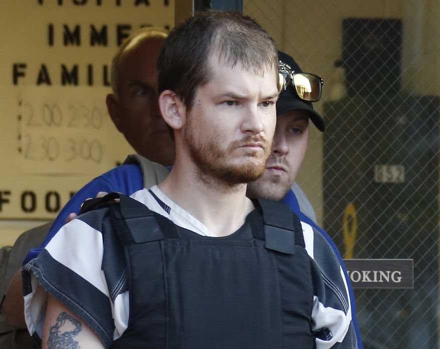 FILE - In this Sept. 11, 2014 file photo, Timothy Ray Jones Jr., is escorted by lawmen out of the Smith County Jail in Raleigh, Miss. A judge has delayed the death penalty trial of Jones Jr., charged with killing his five children until next year. The order from Circuit Judge Eugene Griffith Jr. says both sides agreed to delay Jones’ trial, scheduled to start Monday, Oct. 15, 2018. The order signed Tuesday says a new date will be picked once court dates for 2019 are set. (AP Photo/Rogelio V. Solis, File)
