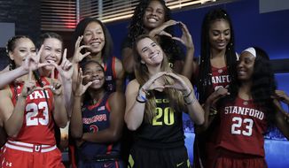 Utah&#39;s Daneesha Provo, far left, and teammate Megan Huff, second from left, pose with Arizona players Sam Thomas, third from top left, and Aarion McDonald, below Thomas, along with Oregon&#39;s Ruthy Hebard, top, and Sabrina Ionescu, bottom, and Stanford&#39;s Dijonai Carrington, top, and Kiana Williams, bottom,  during NCAA college basketball Pac-12 women&#39;s media day in San Francisco, Wednesday, Oct. 10, 2018. (AP Photo/Jeff Chiu)
