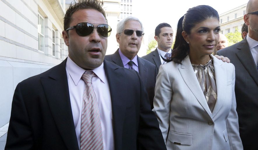 FILE - In this July 30, 2013 file photo, &amp;quot;The Real Housewives of New Jersey&amp;quot; stars Giuseppe &amp;quot;Joe&amp;quot; Giudice, left, and his wife, Teresa Giudice, walk out of Martin Luther King Jr. Courthouse after an appearance in Newark, N.J. Joe Giudice will be deported back to Italy once he’s released from prison next year, according to a judge’s ruling on Wednesday, Oct. 10, 2018.  He appeared before an immigration court in York, Pennsylvania, via teleconference. He has 30 days to file an appeal. He’s currently serving a more than 3-year sentence for fraud and failing to pay taxes. (AP Photo/Julio Cortez, File)