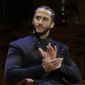 Former NFL football quarterback Colin Kaepernick applauds while seated on stage during W.E.B. Du Bois Medal ceremonies, Thursday, Oct. 11, 2018, at Harvard University, in Cambridge, Mass. Kaepernick is among eight recipients of Harvard University&#39;s W.E.B. Du Bois Medals in 2018. Harvard has awarded the medal since 2000 to people whose work has contributed to African and African-American culture.(AP Photo/Steven Senne)