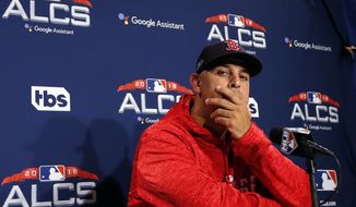 Boston Red Sox manager Alex Cora listens to a question during a news conference at a baseball workout, Thursday, Oct. 11, 2018, in Boston. The Red Sox face the Houston Astros in Game 1 of baseball&#39;s American League Championship Series on Saturday at Fenway Park in Boston. (AP Photo/Elise Amendola)