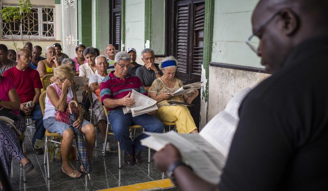 In this Sept. 30, 2018 photo, residents gather for a public forum on constitutional reform in Havana, Cuba. At a half-dozen public forums attended by Associated Press journalists this month, Cubans repeatedly called for direct election of the president and other officials, while many objected to allowing gays and lesbians to marry. (AP Photo/Desmond Boylan)