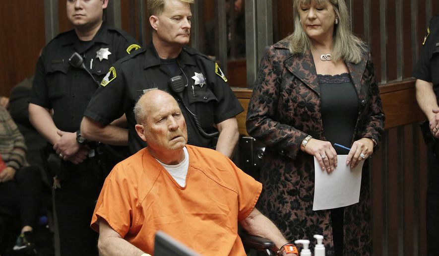 FILE - In this Friday, April 27, 2018 file photo, Joseph James DeAngelo, 72, who authorities suspect is the "Golden State Killer" responsible for at least a dozen murders and 50 rapes in the 1970s and 80s, is accompanied by Sacramento County Public Defender Diane Howard, right, during his arraignment in Sacramento County Superior Court in Sacramento, Calif. Authorities said they used a genetic genealogy website to connect some crime-scene DNA to DeAngelo. (AP Photo/Rich Pedroncelli)