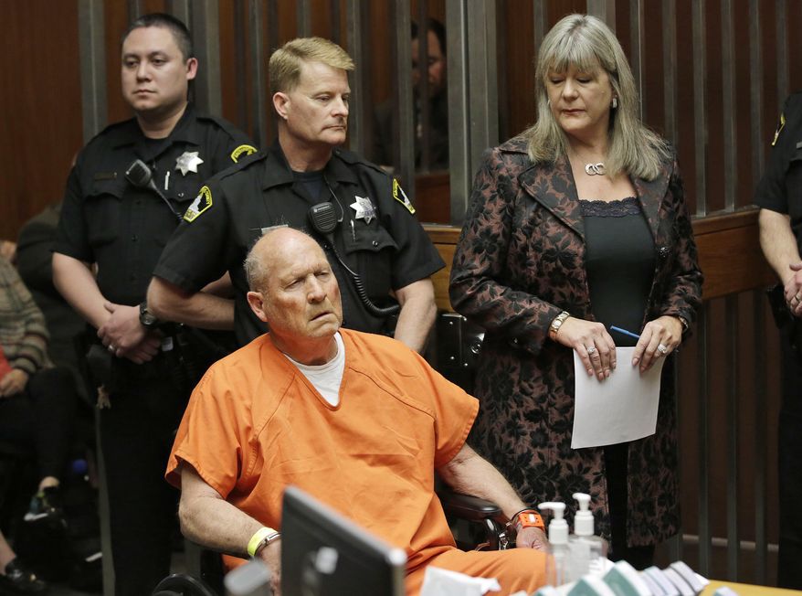 FILE - In this Friday, April 27, 2018 file photo, Joseph James DeAngelo, 72, who authorities suspect is the "Golden State Killer" responsible for at least a dozen murders and 50 rapes in the 1970s and 80s, is accompanied by Sacramento County Public Defender Diane Howard, right, during his arraignment in Sacramento County Superior Court in Sacramento, Calif. Authorities said they used a genetic genealogy website to connect some crime-scene DNA to DeAngelo. (AP Photo/Rich Pedroncelli)