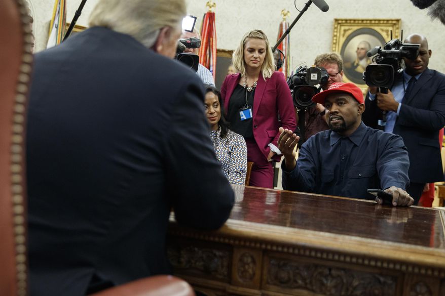 In this Oct. 11, 2018, photo, rapper Kanye West speaks during a meeting in the Oval Office of the White House with President Donald Trump, in Washington. It’s one of Trump’s favorite talking points in touting his administration’s success: The record low rate of black unemployment. (AP Photo/Evan Vucci, File)