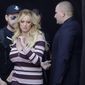 Adult film actress Stormy Daniels, center, arrives for the opening of the adult entertainment fair &quot;Venus&quot; in Berlin, Germany, Thursday, Oct. 11, 2018. (AP Photo/Markus Schreiber)