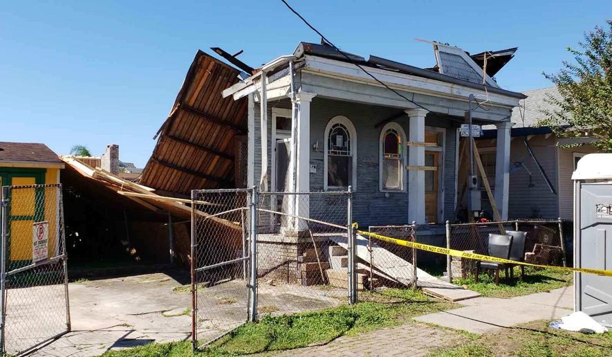 This photo provided by New Orleans EMS shows a home that collapsed during renovations injuring more than 10 people in New Orleans on Thursday, Oct. 11, 2018. (New Orleans EMS via AP)