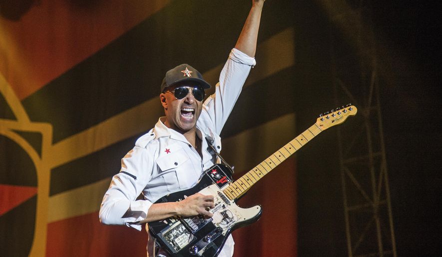 In this Oct. 1, 2017 file photo, Tom Morello, of Prophets of Rage, performs at the Louder Than Life Music Festival in Louisville, Ky. Morello released his latest album, "The Atlas Underground," on Friday. (Photo by Amy Harris/Invision/AP, File)