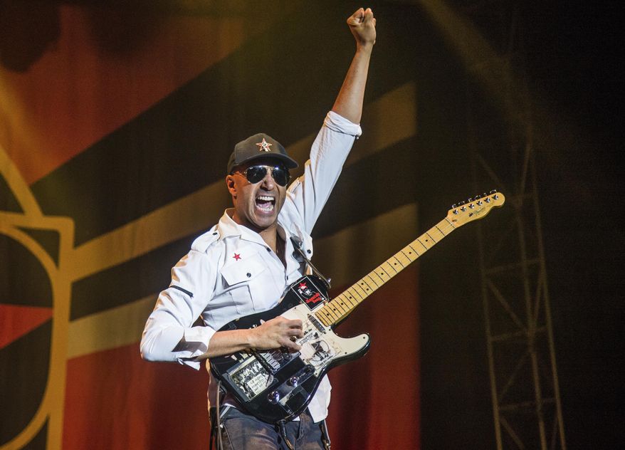 In this Oct. 1, 2017 file photo, Tom Morello, of Prophets of Rage, performs at the Louder Than Life Music Festival in Louisville, Ky. Morello released his latest album, "The Atlas Underground," on Friday. (Photo by Amy Harris/Invision/AP, File)