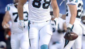 FILE - In this Aug. 9, 2018, file photo, Carolina Panthers tight end Greg Olsen (88) takes the field prior to an NFL football game against the Buffalo Bills, in Orchard Park, N.Y.  The Panthers are hoping to get three-time Pro Bowl tight end Greg Olsen back from just four weeks after re-breaking his foot. Cam Newton said he can&#39;t stress enough how important Olsen is to the team&#39;s offense. (AP Photo/Adrian Kraus, File)