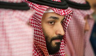 FILE - In this March 22, 2018, file photo, Saudi Crown Prince Mohammed bin Salman meets with U.S. Defense Secretary Jim Mattis at the Pentagon in Washington. In a kingdom once ruled by an-ever aging rotation of elderly monarchs, Saudi Crown Prince Mohammed bin Salman stands out as a youthful face of a youthful nation. But behind a carefully coiffed public-relations operation highlighting images of him smiling in meetings with the world’s top business executives and leaders like President Donald Trump, a darker side lurks as well.(AP Photo/Cliff Owen, File)
