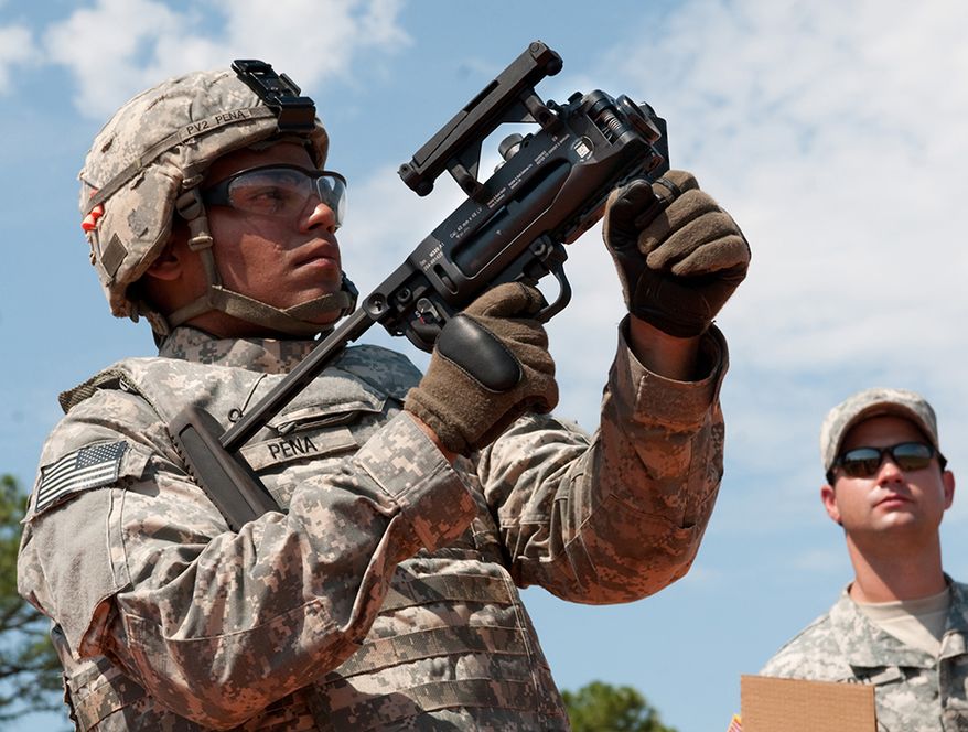 M320 Grenade Launcher - A Paratrooper with 1st Brigade Combat Team, 82nd Airborne Division, fires a training round from the new M320 grenade launcher in its standalone configuration while learning to use the weapon on a Fort Bragg, N.C., range July 1, 2009. The brigade was the first unit in the Army to receive the advanced grenade launcher that will replace the Vietnam-era M203. (U.S. Army photo by Spc. Michael J. MacLeod) (Released)