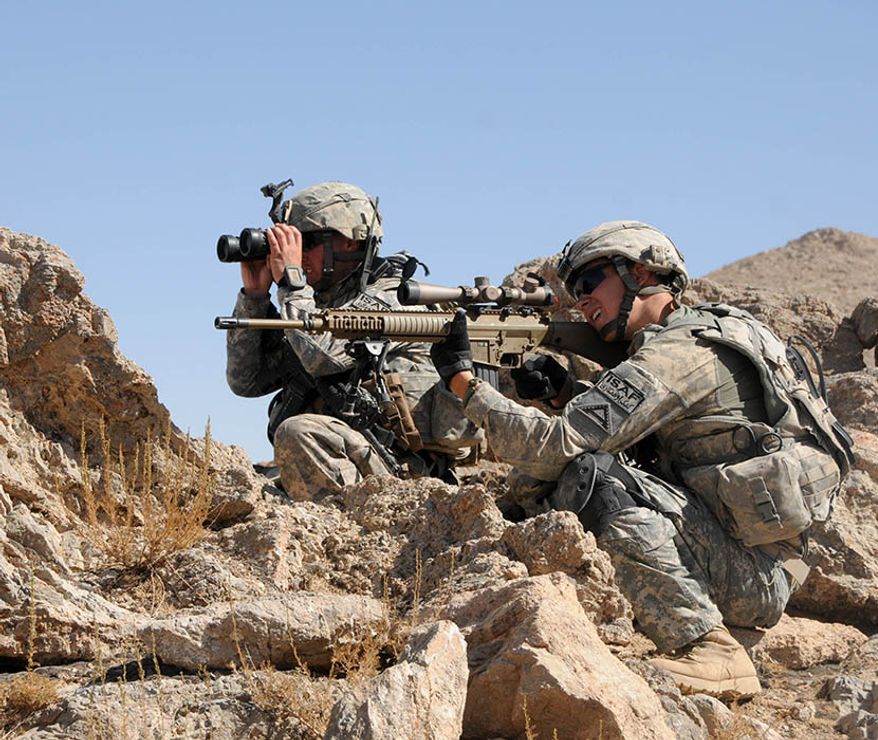 In this file photo, U.S. Army soldiers with Charlie Company, 1st Battalion, 4th Infantry Regiment look for suspicious activity from an observation point during an area reconnaissance mission off Highway 1 in Zabul province, Afghanistan, on Oct. 1, 2010.  A female soldier in the Montana Army National Guard became the first woman to complete the U.S. Army Sniper Course, Army officials announced.  (DOD photo by Spc. Joshua Grenier, U.S. Army) **FILE**