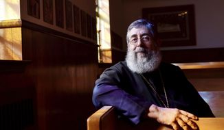 This Wednesday Oct. 3, 2018 photo shows Father Samuel Haddad at the St. Nicholas Orthodox Church in Beckley, W.Va. (Chris Jackson/The Register-Herald)