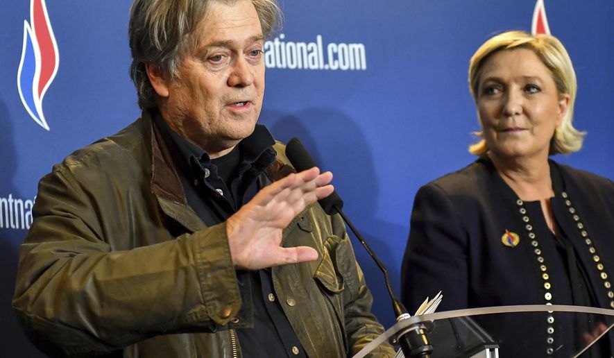 FILE - In this Saturday, March 10, 2018 file photo, former White House strategist Steve Bannon holds a press conference with National Front party leader Marine Le Pen, right, at the party congress in the northern French city of Lille. Far-right French leader Marine Le Pen has met with former White House strategist Steve Bannon and signaled her interest in his project to help European populist parties _ just days after rejecting assistance from an American. (AP Photo, File)
