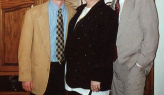 This undated photo provided by the Matthew Shepard Foundation, shows Matthew Shepard, left, with his parents, Judy and Dennis Shepard. The murder of Shepard, a gay University of Wyoming student, was a watershed moment for gay rights and LGBTQ acceptance in the U.S., so much so that 20 years later the crime remains seared into the national consciousness. (The Matthew Shepard Foundation via AP)