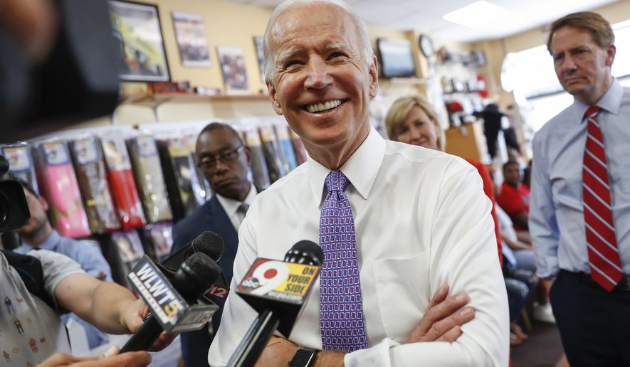 FILE - In this June 29, 2018, file photo, former Vice President Joe Biden speaks to the media in Cincinnati. Home to the first-in-the-South primaries, South Carolina is accustomed to the parade of presidential candidates who frequent the state in hopes of boosting their national credibility. But, with eager Democrats’ open 2020 contest, that competition has begun here early, with candidates lining up visits with a frequency accelerated from years past. Biden, who has said it’ll be at least January before he decides about 2020, has been keeping an elevated profile in South Carolina this midterm cycle, even for him (AP Photo/John Minchillo, File)