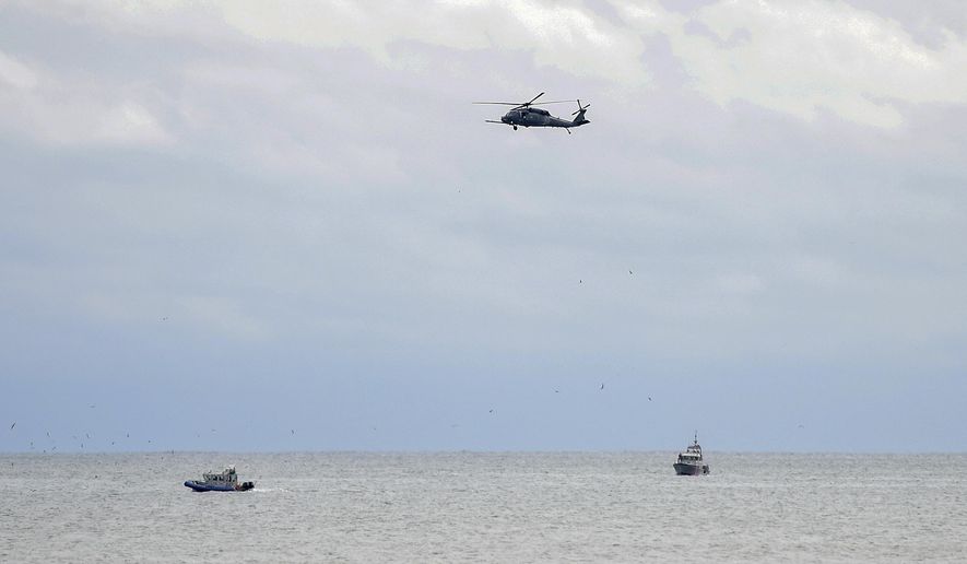 Rescue personnel search for a plane that crashed into the waters off Quogue on New York's Long Island Saturday, Oct. 13, 2018. Authorities on Long Island say a small private plane carrying three people crashed into the ocean Saturday several miles off the Hamptons. (James Carbone/Newsday via AP)