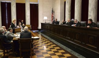 Attorney Teresa Toriseva, left, presents arguments before the West Virginia Supreme Court of Appeals on Monday, Sept. 24, 2018, at the West Virginia State Capital in Charleston,WV. The court dismissed petitions challenging the candidacy of U.S. Rep. Evan Jenkins for the court and the validity of Jenkins&#39;s and former state House Speaker Tim Armstead&#39;s temporary appointments to the Supreme Court. (Kenny Kemp/Charleston Gazette-Mail via AP)